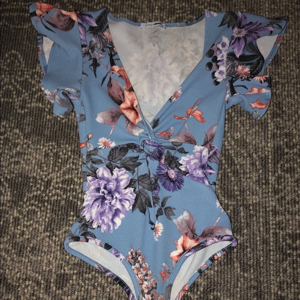Blue floral body suit with snap closure